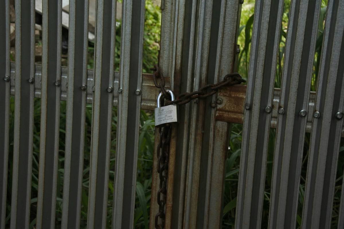 a padlock is attached to a metal gate