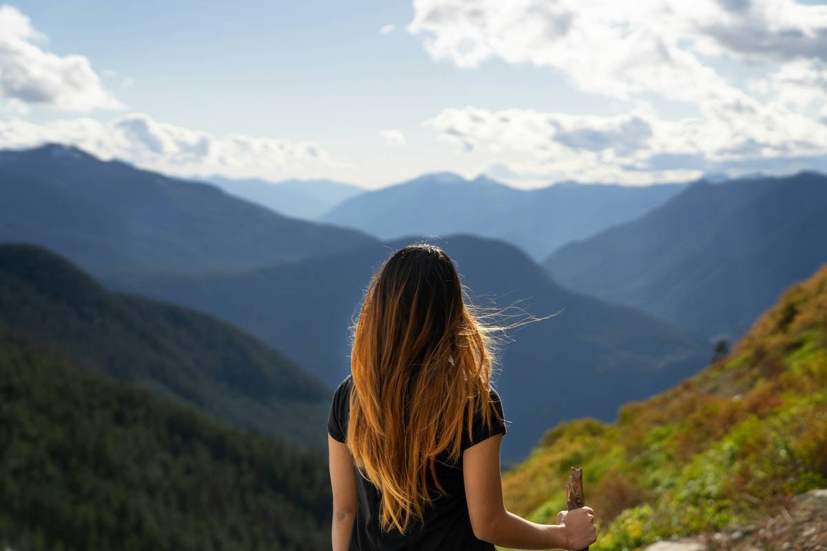 Girl overlooking mountain range