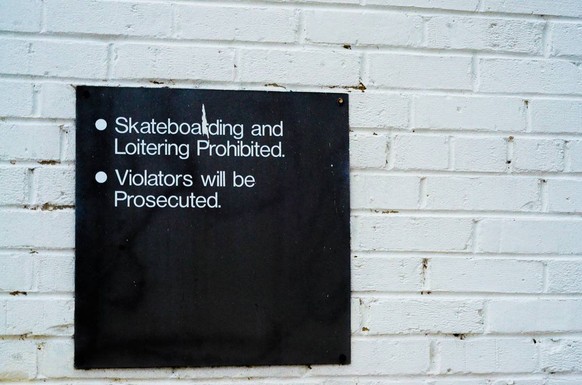 skateboarding and loitering prohibited and violators will be prosecuted text