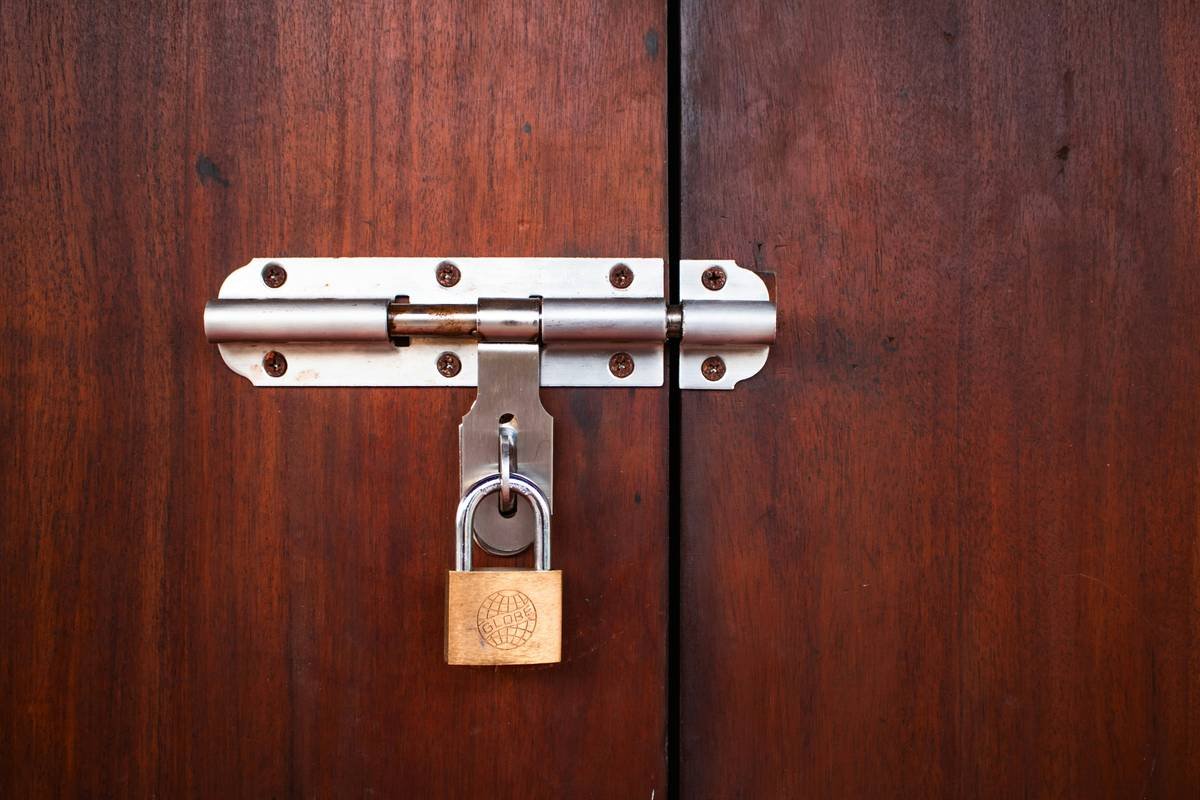 Close-up of a failed adhesive pet lock with visible separation—pet lock troubleshooting example